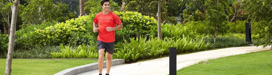 Jogging Person in the garden area of the residential building