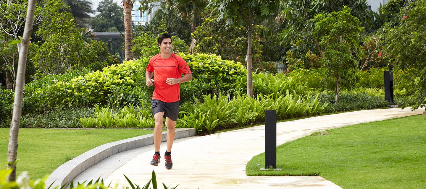 Jogging Person in the garden area of the residential building